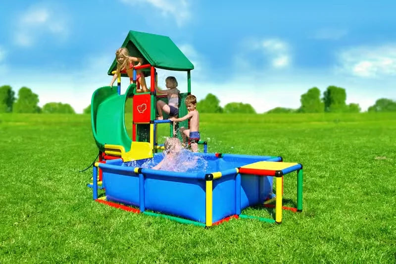 Covered QUADRO tower with green curved slide leading into a large blue pool